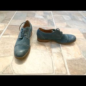 Clark’s 1825 blue suede dress shoes.